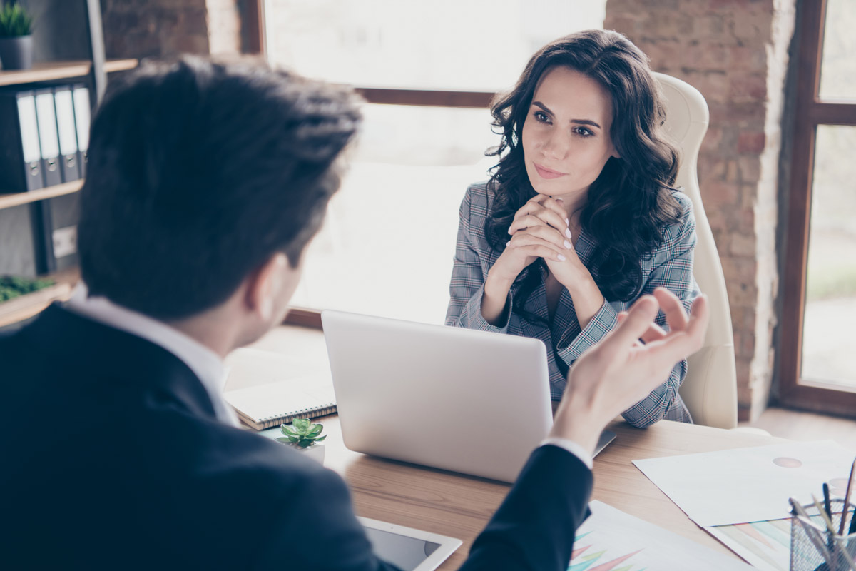 Woman listening intently to business owner